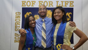 Three alumni posing for photo.