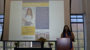 An alumni presenting a power point.